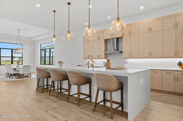 a spacious bedroom with a bed and large window