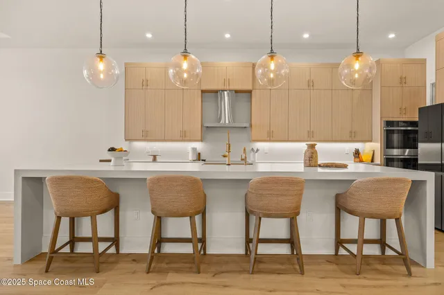 a living room with a bed furniture and next to a window