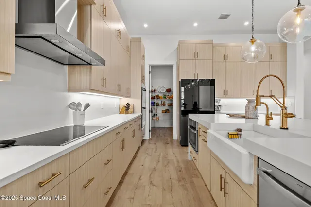a spacious bathroom with a double vanity sink a mirror and a bathtub