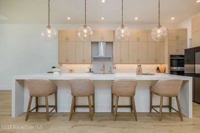 a large bathroom with a double vanity sink a large mirror and a shower