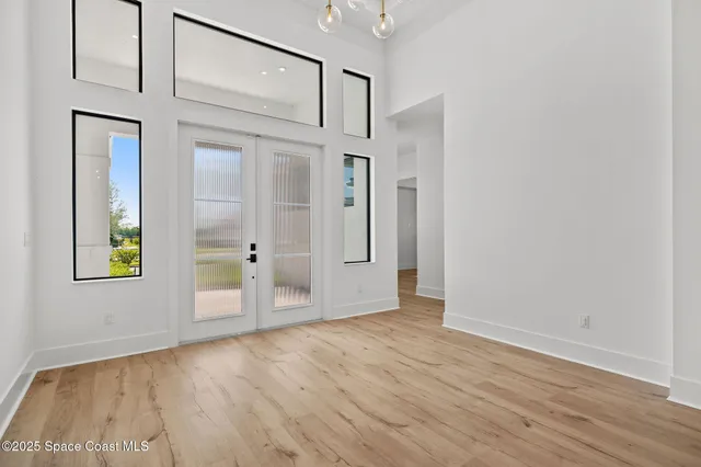 a bedroom with a bed and a potted plant