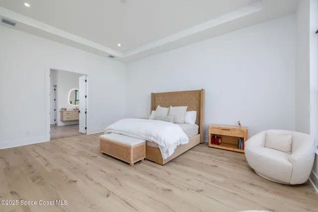 a bedroom with a bed and a lamp