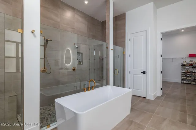 a bathroom with a granite countertop sink a toilet and a shower