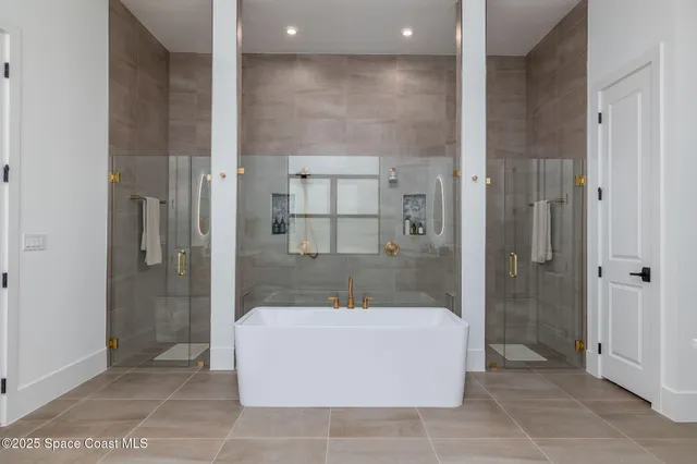 a utility room with cabinets washer and dryer
