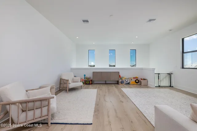 an aerial view of a house with a big yard swimming pool and outdoor seating