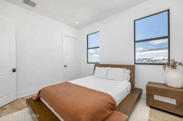 an aerial view of a pool lawn chairs and a fire pit