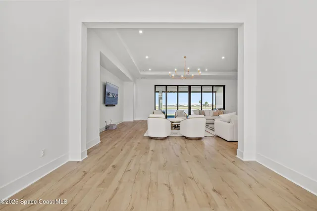 a large kitchen with a sink and cabinets