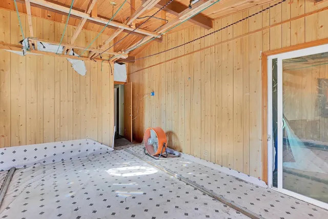 a bedroom with a bed and walk in closet