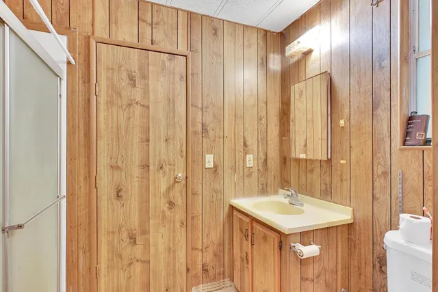 a kitchen with stainless steel appliances granite countertop a sink and cabinets