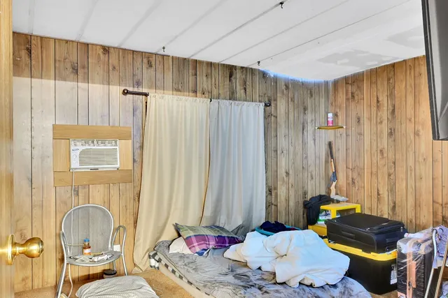 a utility room with stainless steel appliances granite countertop a stove and a refrigerator