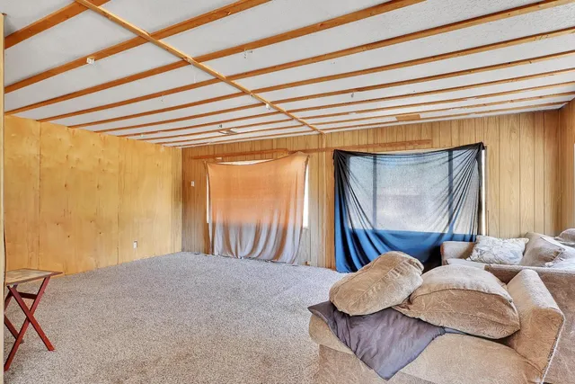 a view of a house with a yard covered with snow