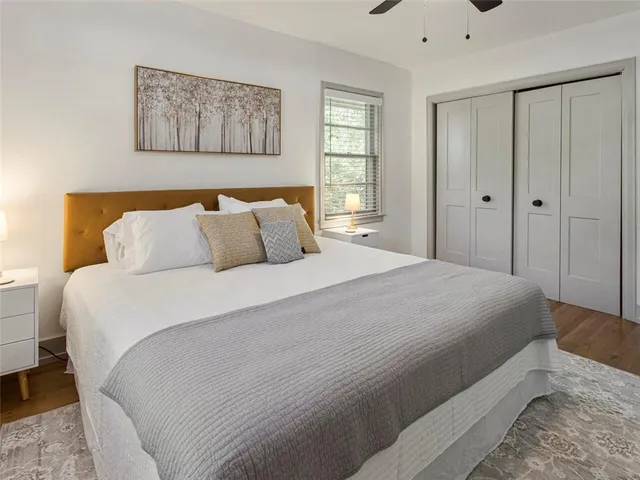 a bedroom with a bed and a window