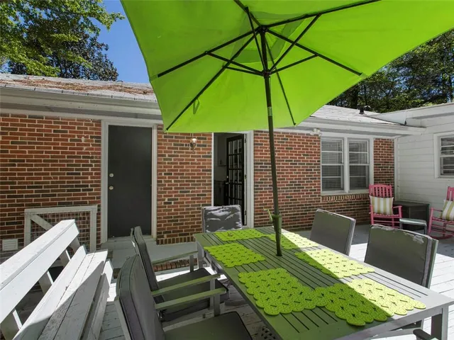 a view of an outdoor sitting area with furniture