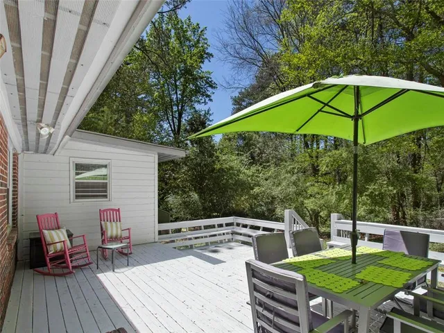 a patio with a patio table and chairs