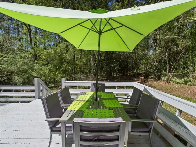 a view of a chairs and table in the patio