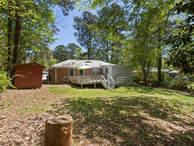 a backyard of a house with lots of green space