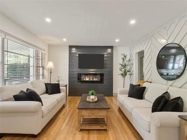 a living room with furniture and a large window