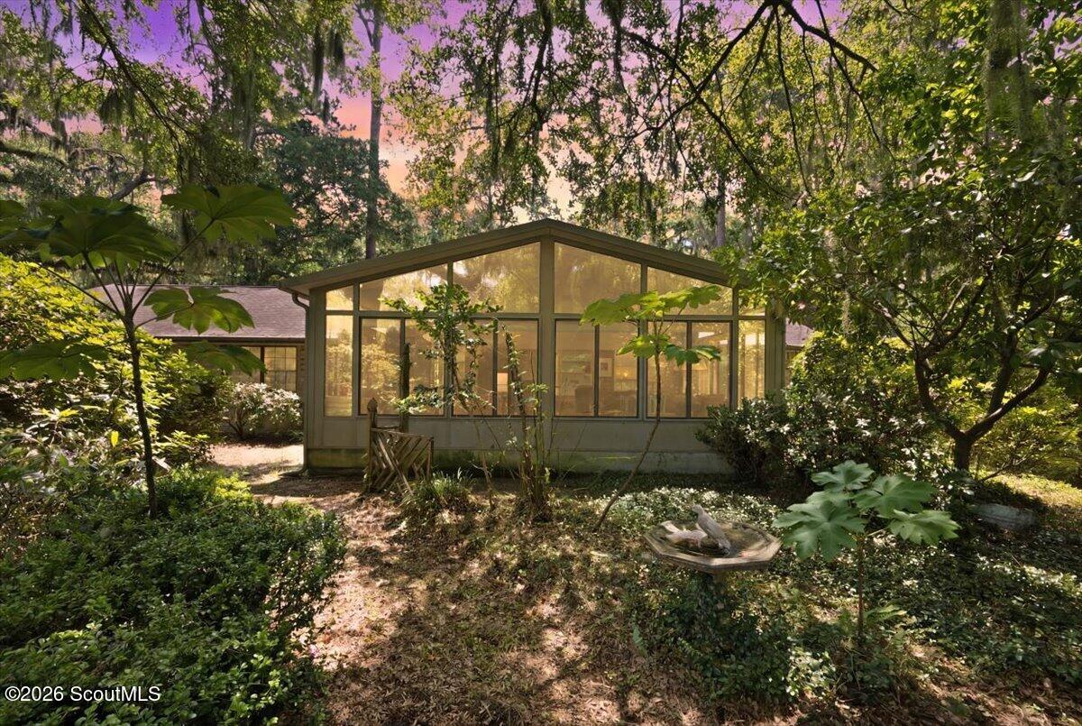 554 Old Plantation Road Jekyll Island, GA 31527 - Photo 2 of 58 the sunroom in the back of the home.