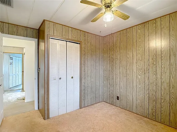 a white toilet sitting next to a shower curtain