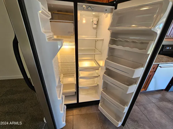 a stove top oven sitting inside of a kitchen