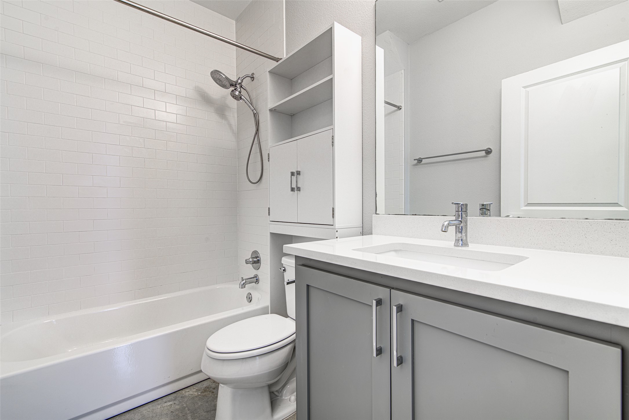 1904 Bunche Road, Unit B Austin, TX 78721 - Photo 22 of 29 Downstairs full bathroom with a quartz vanity, tub/shower combination, and subway tile surround, conveniently located near the downstairs bedroom.