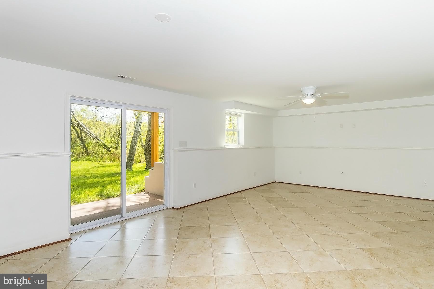 4837 Avery Road Shady Side, MD 20764 - Photo 20 of 27 Lower Level Living Room with Ceramic Tile