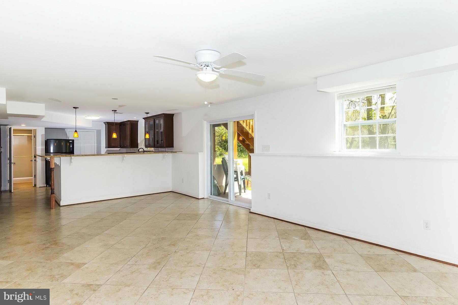 4837 Avery Road Shady Side, MD 20764 - Photo 21 of 27 Lower Level Eat-in Area with Walk-out