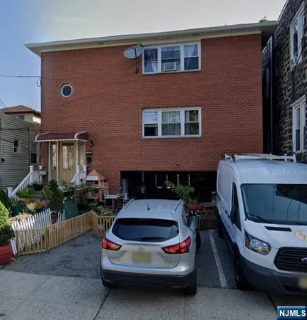 a car parked in front of a house