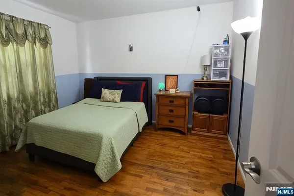 a bedroom with a bed and a closet