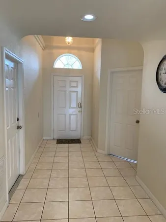 an empty room with closet and a mirror