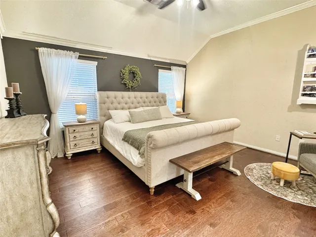 a bedroom with a bed and a chair