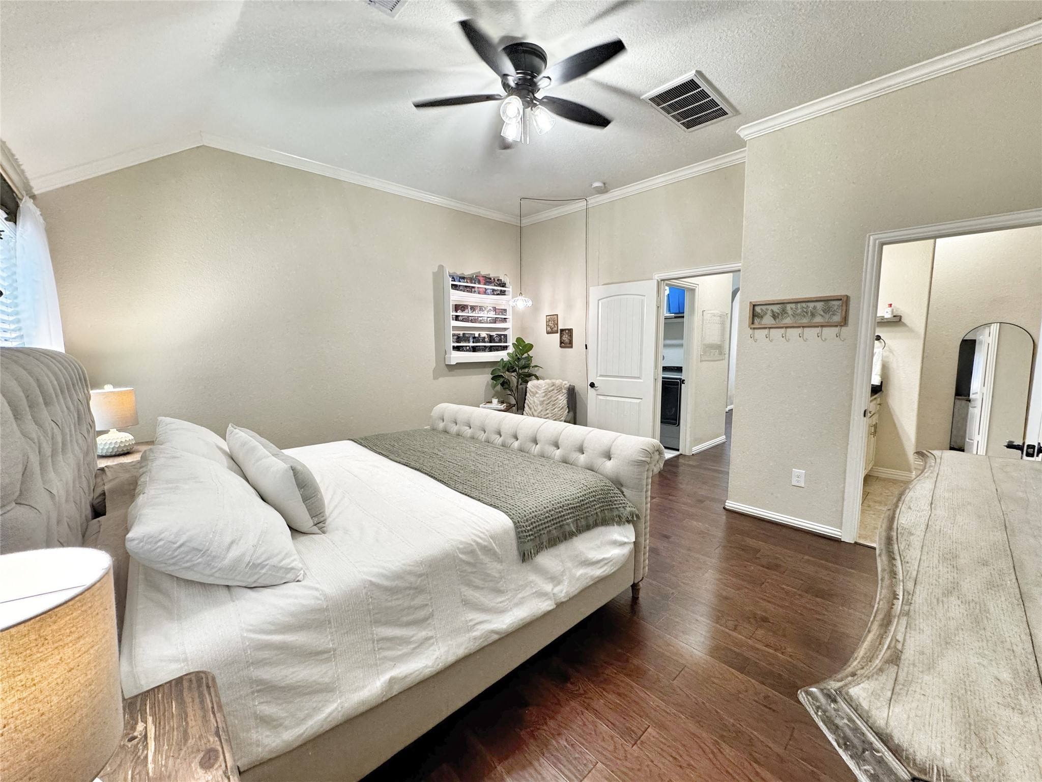 3857 Enchanted Timbers Lane Spring, TX 77386 - Photo 22 of 39 a bedroom with a large bed and a chandelier