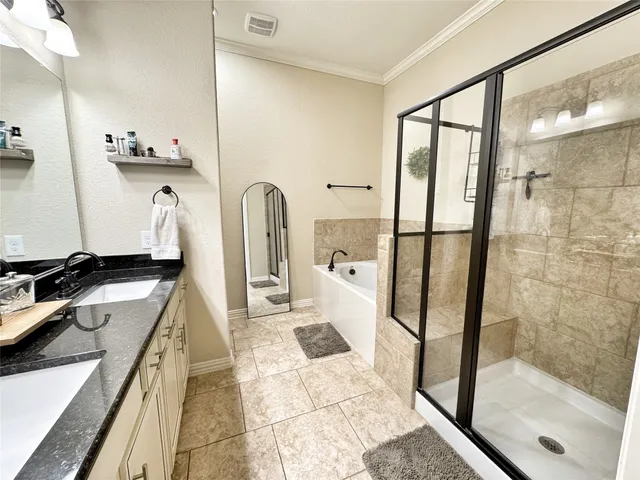 a bathroom with a tub and shower