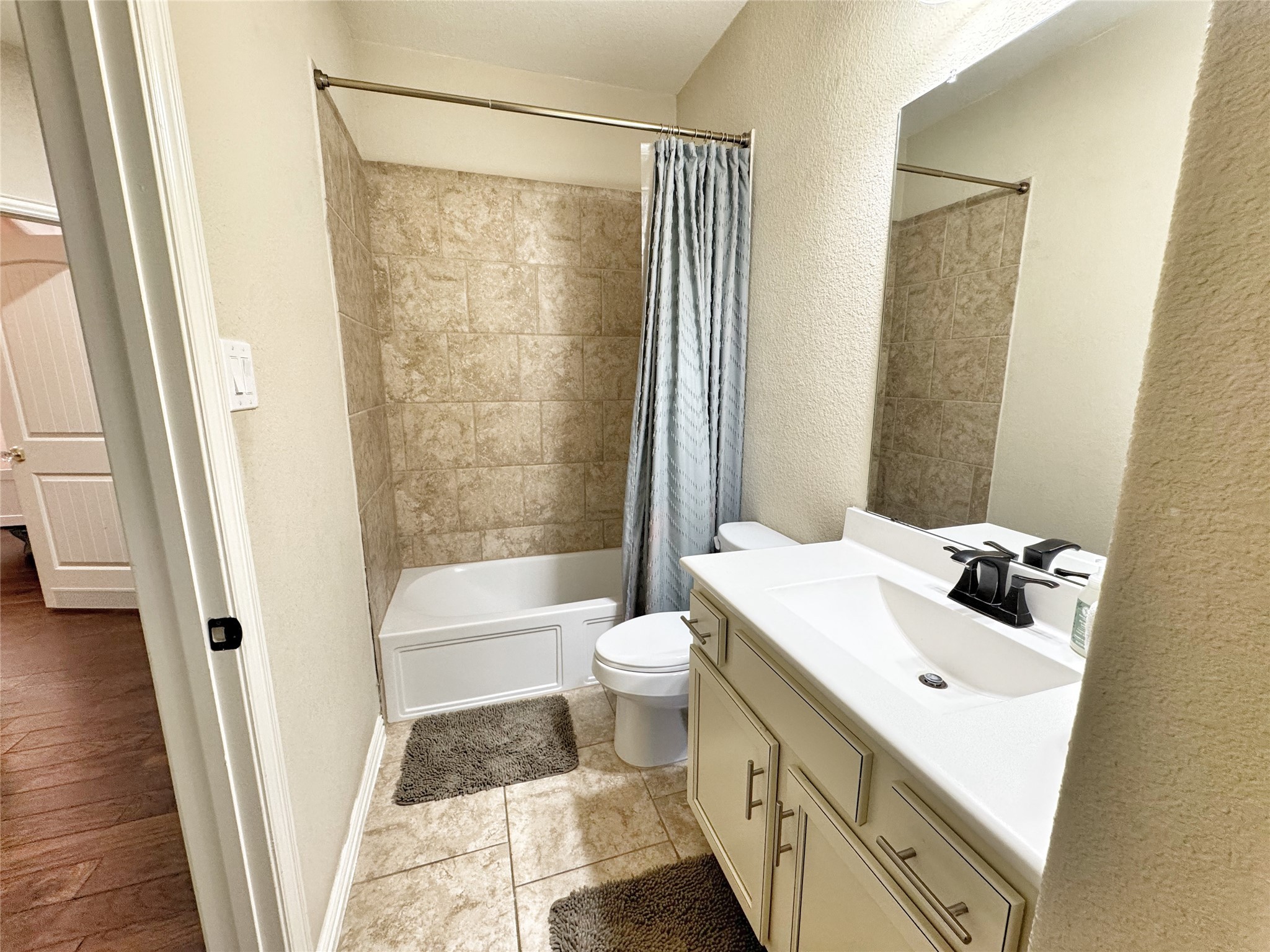 3857 Enchanted Timbers Lane Spring, TX 77386 - Photo 26 of 39 a bathroom with a sink a toilet tub and shower