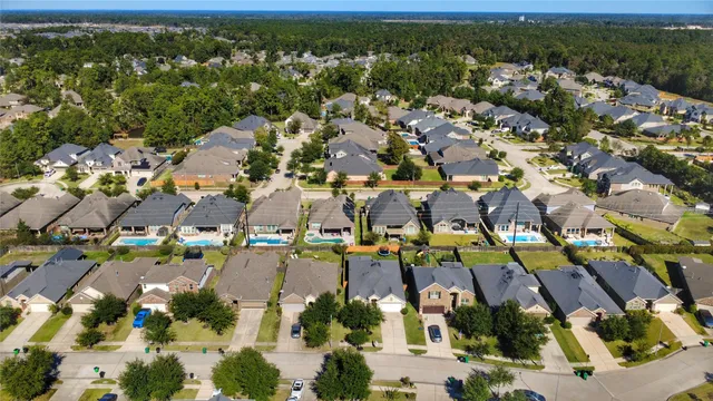 an aerial view of house with yard swimming pool and outdoor seating