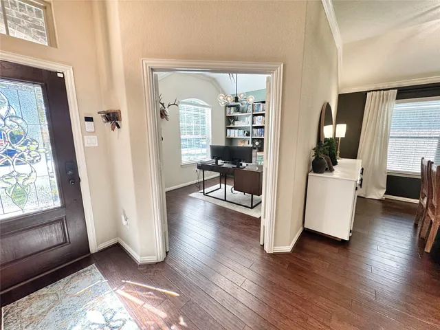 a view of a living room and hardwood floor