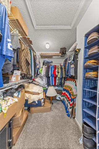 a spacious bathroom with a tub a sink and mirror