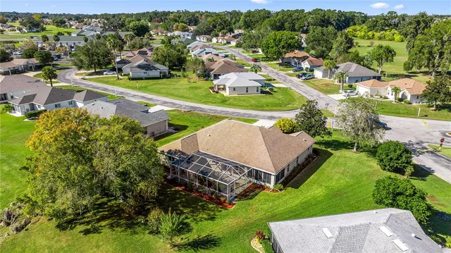 an aerial view of a house with a garden