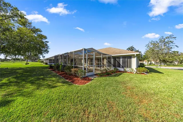 a front view of a house with yard porch and furniture