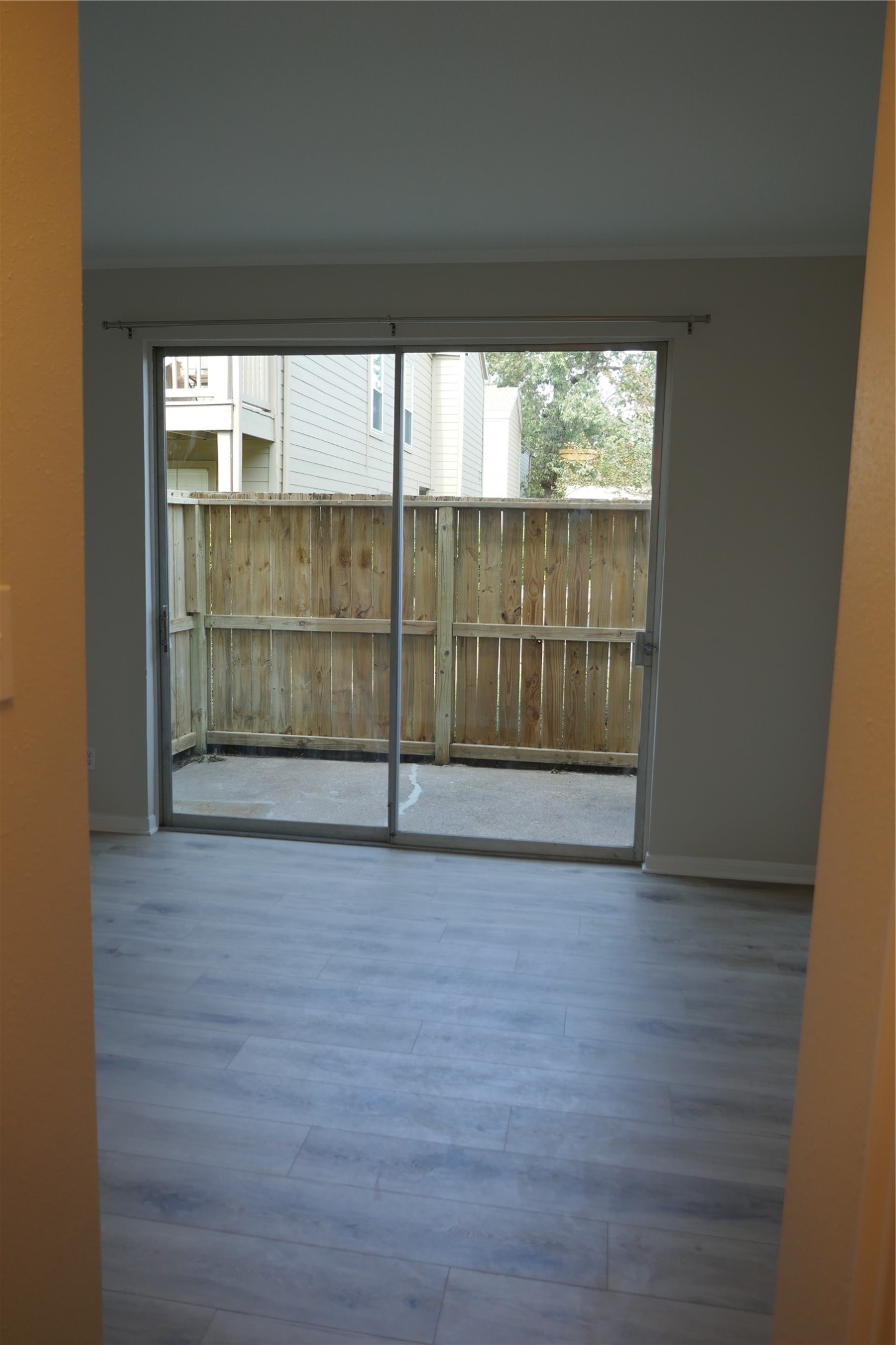2100 Tanglewilde Street, Unit 347 Houston, TX 77063 - Photo 10 of 19 a view of a room with wooden floor and fence