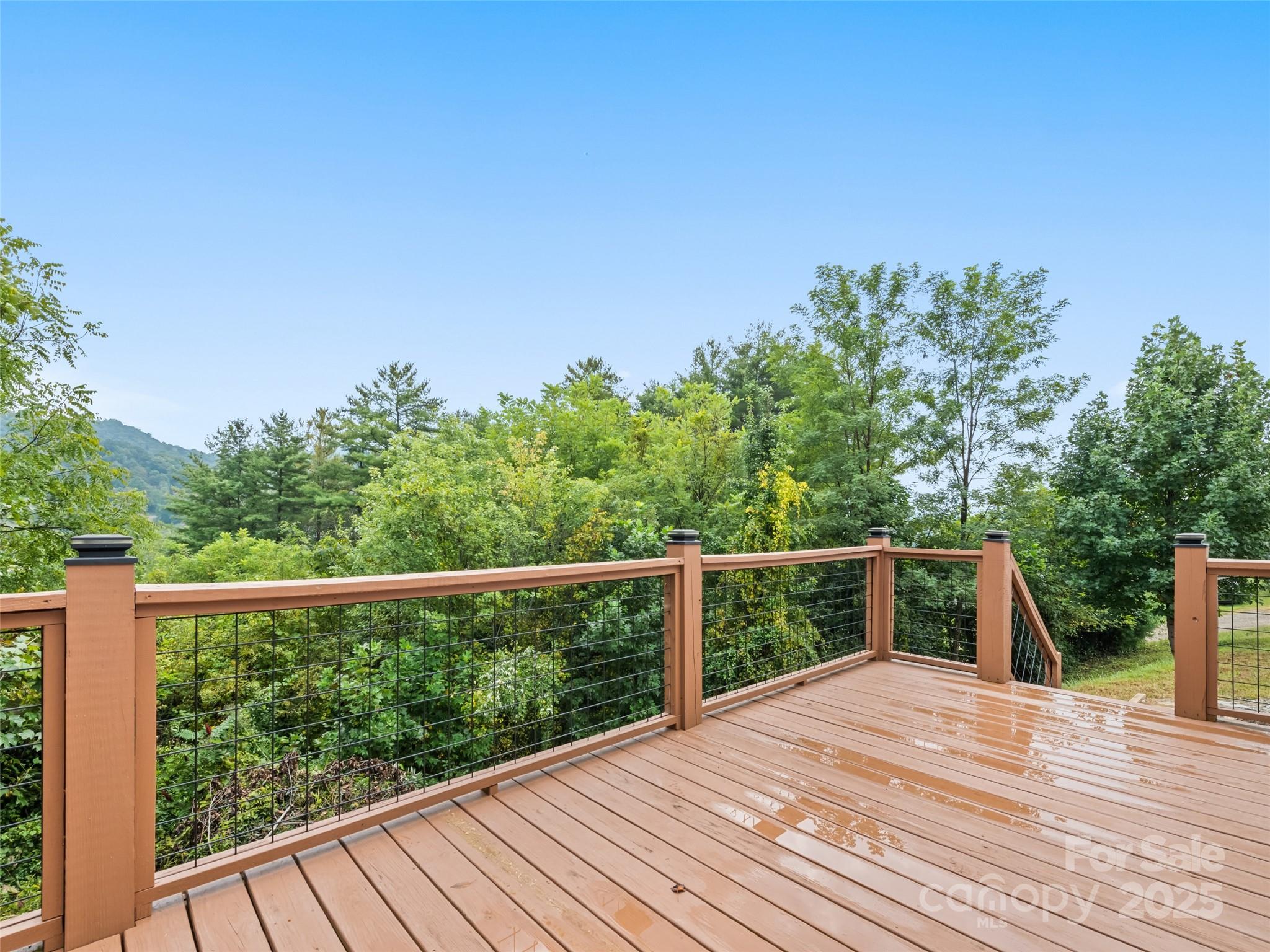 120 Simonds Ridge Canton, NC 28716 - Photo 11 of 36 a view of a balcony with wooden floor and fence