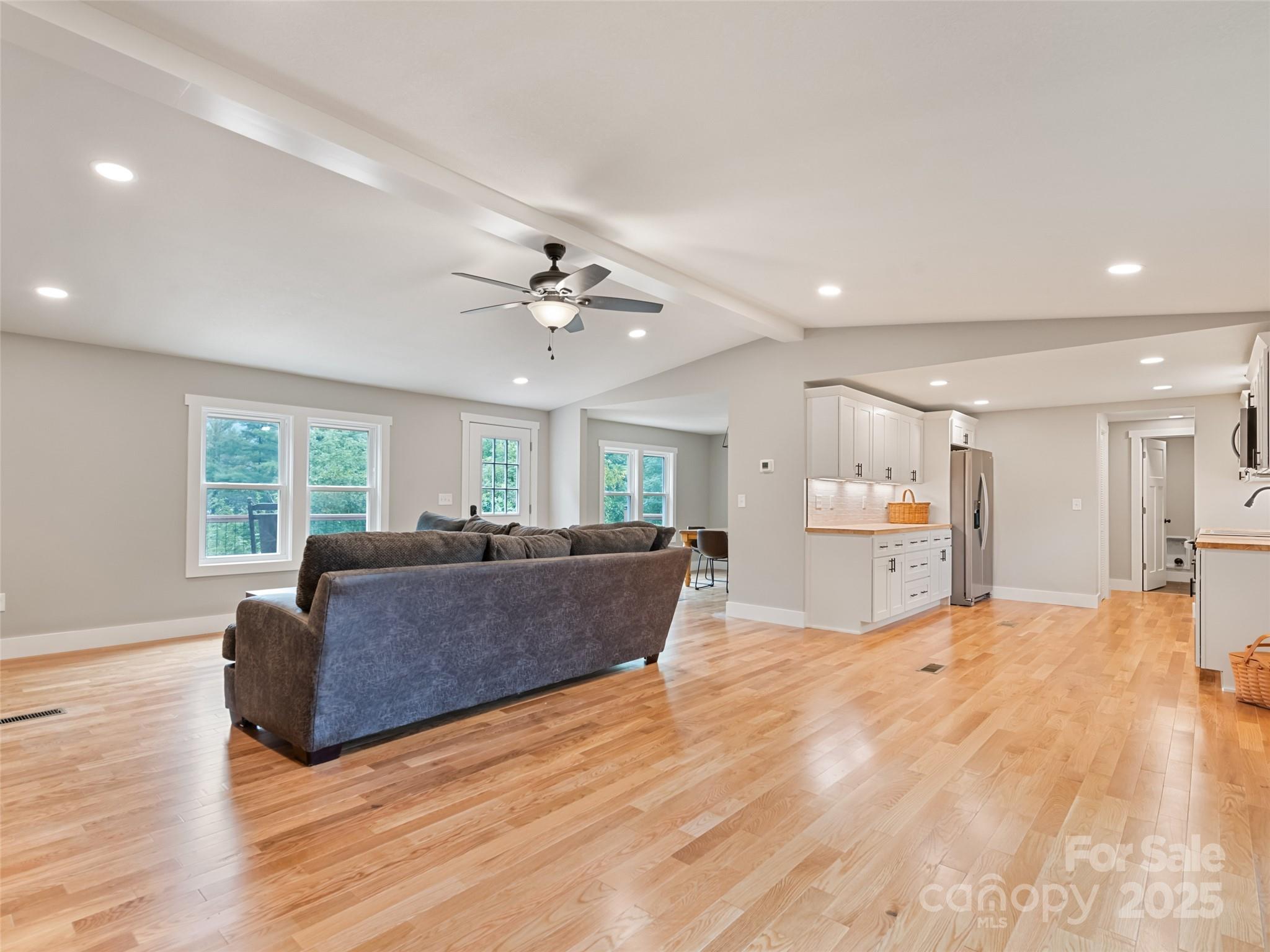 120 Simonds Ridge Canton, NC 28716 - Photo 18 of 36 a living room with furniture and a ceiling fan