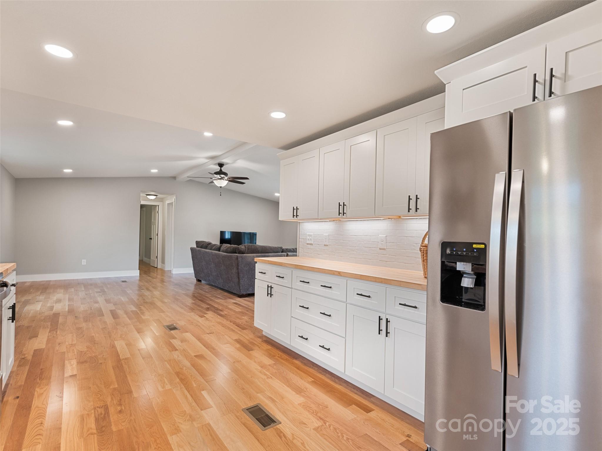 120 Simonds Ridge Canton, NC 28716 - Photo 2 of 36 a kitchen with stainless steel appliances kitchen island granite countertop a refrigerator and a sink