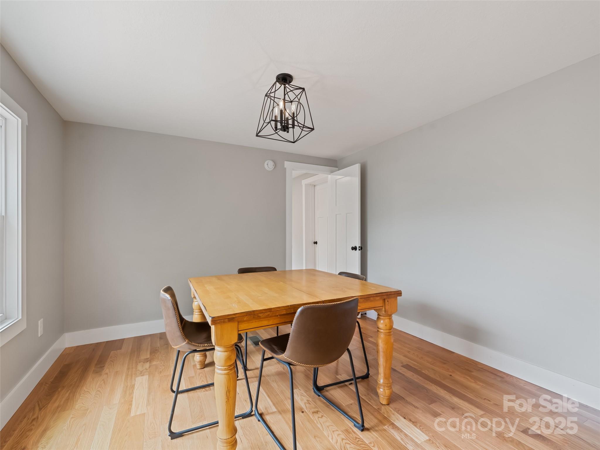 120 Simonds Ridge Canton, NC 28716 - Photo 21 of 36 a view of a dining room with furniture and wooden floor