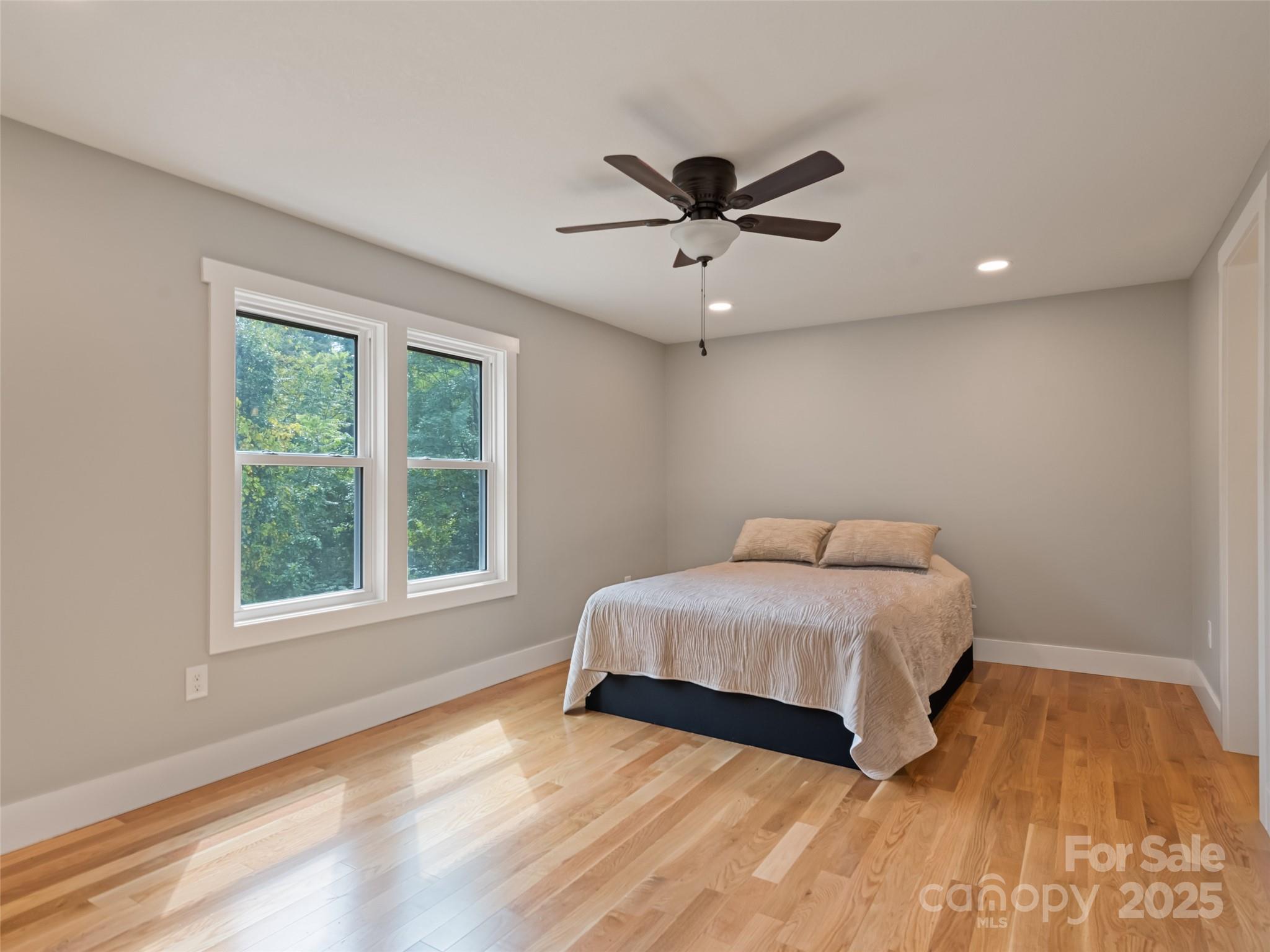 120 Simonds Ridge Canton, NC 28716 - Photo 23 of 36 a bedroom with a large bed and a window
