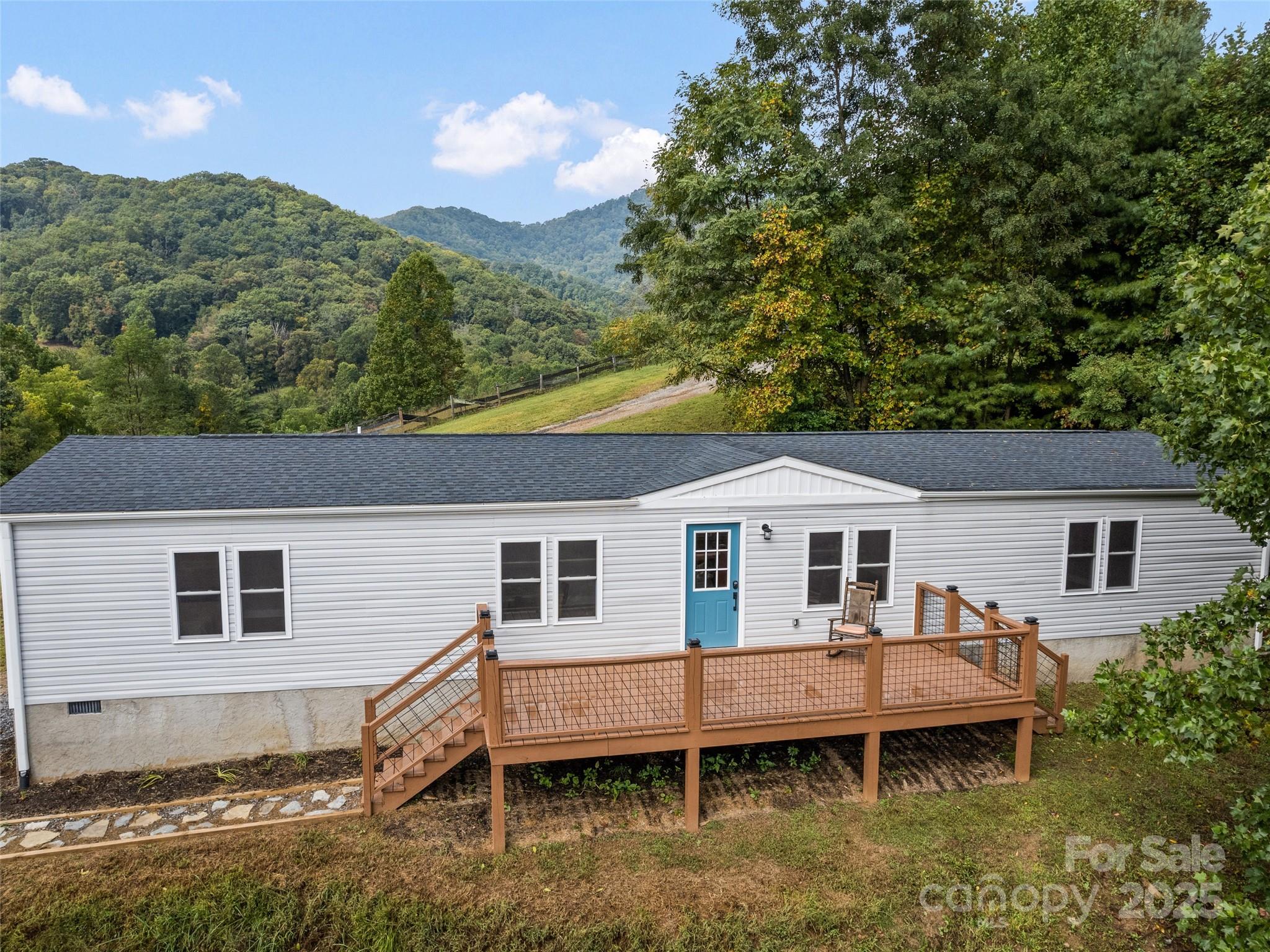 120 Simonds Ridge Canton, NC 28716 - Photo 30 of 36 a front view of a house with a yard and balcony