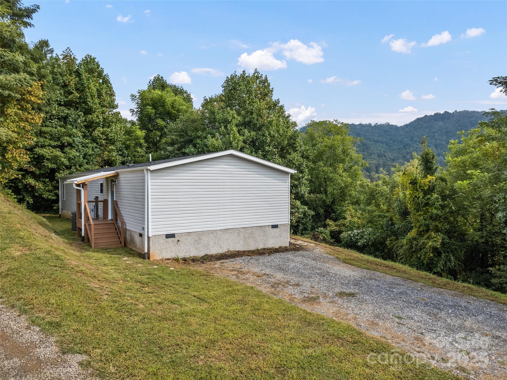120 Simonds Ridge Canton, NC 28716 - Photo 31 of 36 a view of a house with a yard