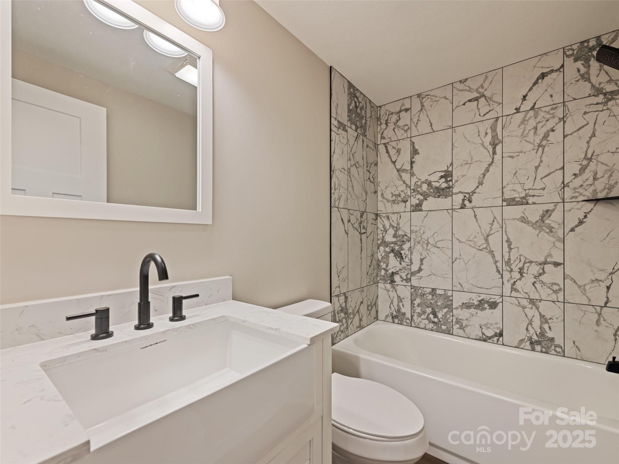 120 Simonds Ridge Canton, NC 28716 - Photo 5 of 36 a bathroom with a sink a toilet and a bathtub