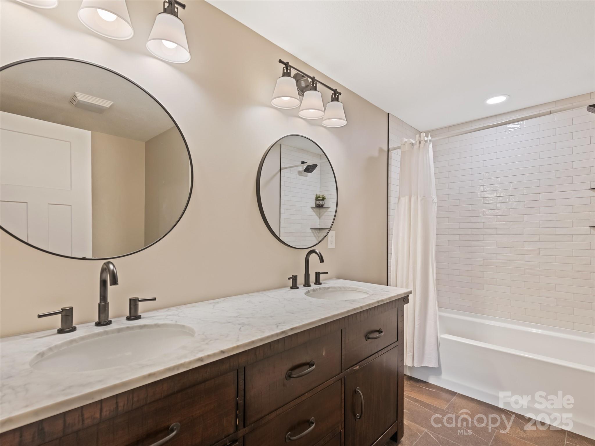 120 Simonds Ridge Canton, NC 28716 - Photo 7 of 36 a bathroom with a double vanity sink and a mirror