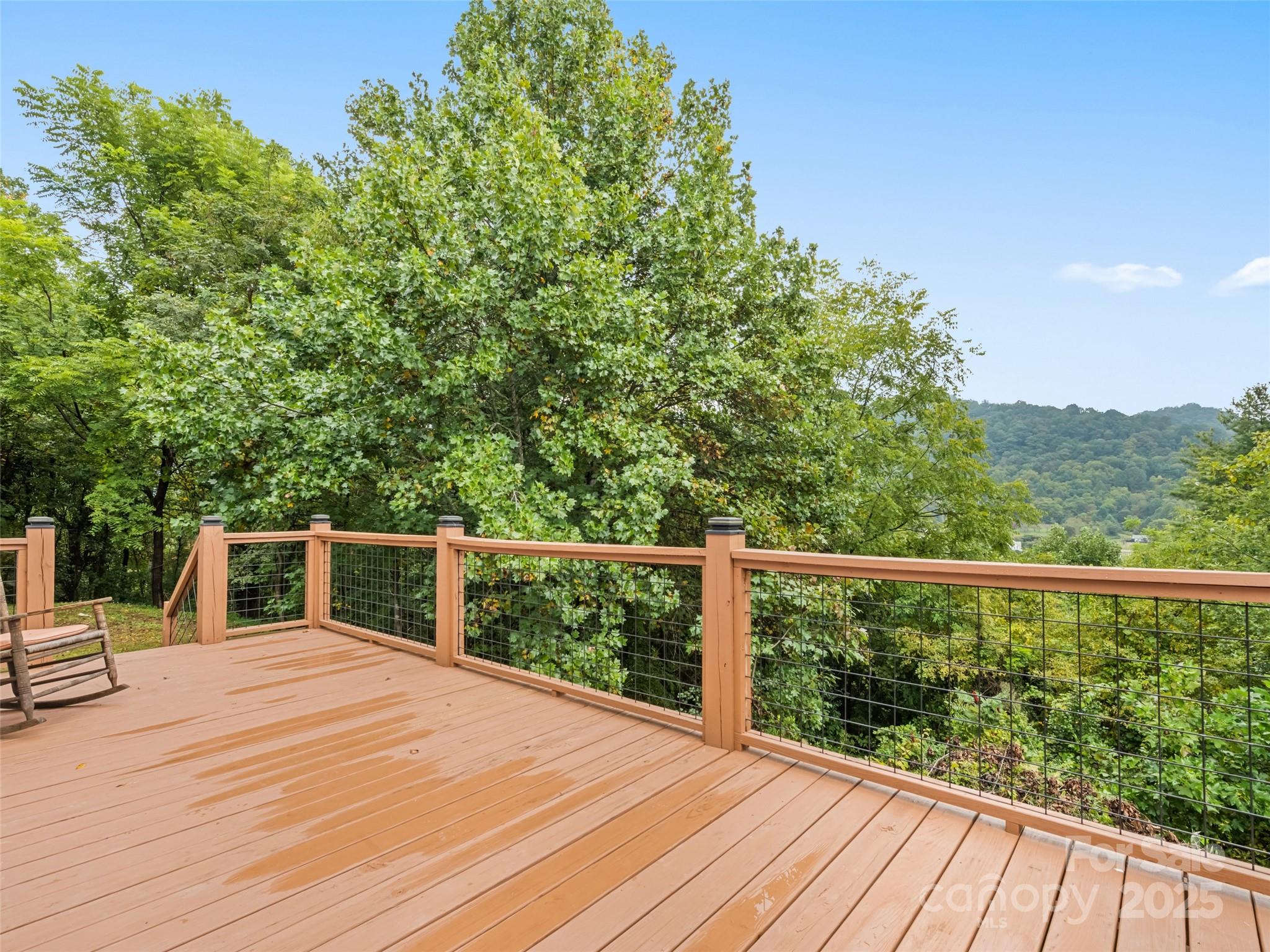 120 Simonds Ridge Canton, NC 28716 - Photo 10 of 36 a view of balcony with wooden floor and fence